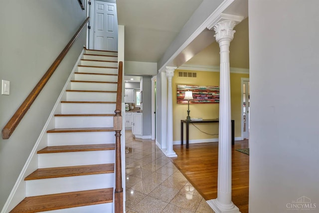 5681 Thomaridge Ct, Green Twp, OH 45248 - stairs with decorative columns, granite floors, and ornamental molding