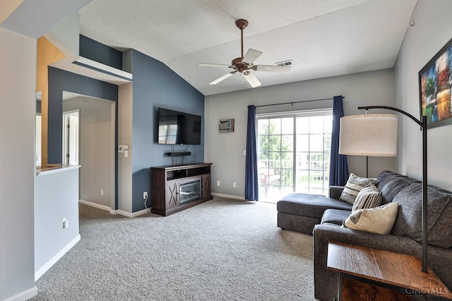 4282 Hickory Park Ln, Batavia Twp, OH 45103 - living area with carpet flooring, vaulted ceiling, a ceiling fan, a fireplace, and a textured ceiling