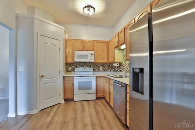 4282 Hickory Park Ln, Batavia Twp, OH 45103 - kitchen featuring stainless steel appliances, light wood finished floors, light countertops, and tasteful backsplash