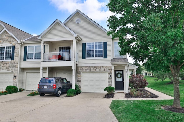 4282 Hickory Park Ln, Batavia Twp, OH 45103 - view of front of house featuring stone siding, driveway, a garage, and a front yard