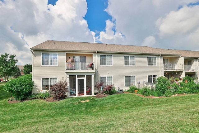 4282 Hickory Park Ln, Batavia Twp, OH 45103 - rear view of property with a yard, a balcony, and a sunroom