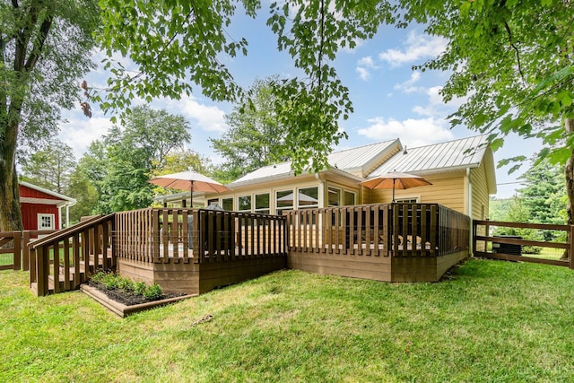 3008 State Route 133, Bethel, OH 45106 - rear view of property with a wooden deck, a yard, and a metal roof