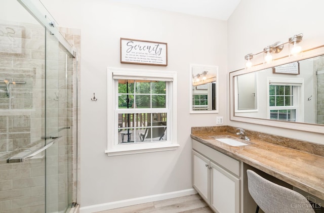 3008 State Route 133, Bethel, OH 45106 - bathroom with vanity, a stall shower, and wood finished floors