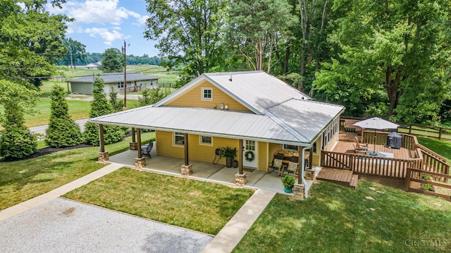 3008 State Route 133, Bethel, OH 45106 - country-style home with a metal roof and a deck