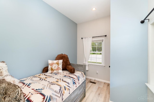 3008 State Route 133, Bethel, OH 45106 - bedroom featuring light wood-style flooring and recessed lighting