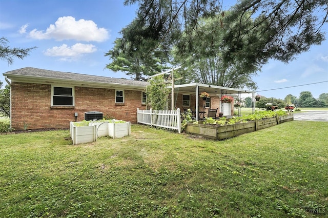 8135 Faller Rd, Hamilton Twp, OH 45039 - rear view of house with a lawn and brick siding
