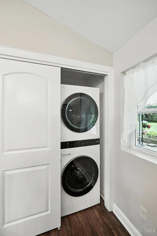 8135 Faller Rd, Hamilton Twp, OH 45039 - laundry area with stacked washer / dryer and dark wood-style floors