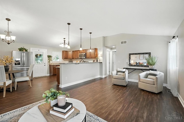 8135 Faller Rd, Hamilton Twp, OH 45039 - living room with a chandelier, lofted ceiling, and dark wood finished floors