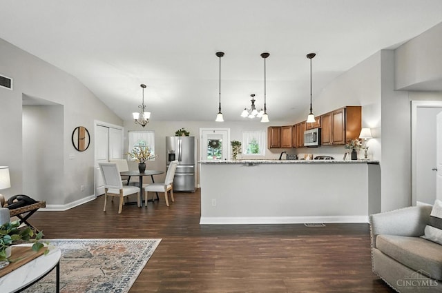 8135 Faller Rd, Hamilton Twp, OH 45039 - living room featuring vaulted ceiling, dark wood-type flooring, and a chandelier