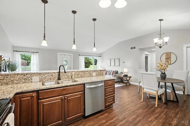 8135 Faller Rd, Hamilton Twp, OH 45039 - kitchen featuring appliances with stainless steel finishes, vaulted ceiling, dark wood-type flooring, decorative light fixtures, and light stone countertops