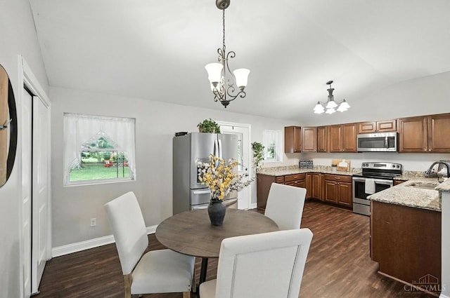 8135 Faller Rd, Hamilton Twp, OH 45039 - dining area with a chandelier, vaulted ceiling, and dark wood finished floors