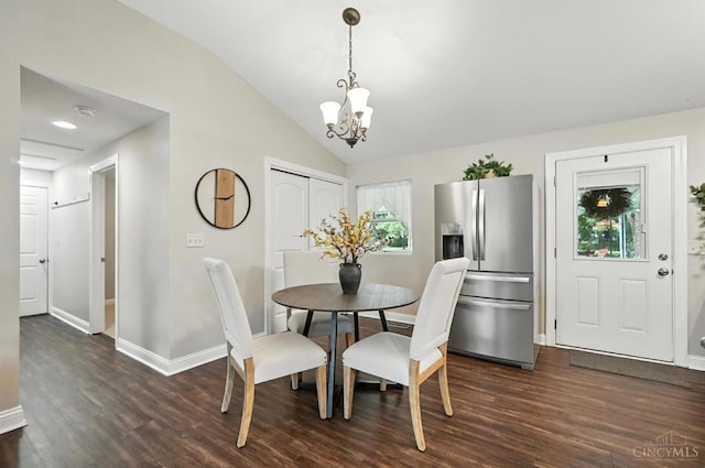 8135 Faller Rd, Hamilton Twp, OH 45039 - dining room with a chandelier, dark wood-style floors, and vaulted ceiling