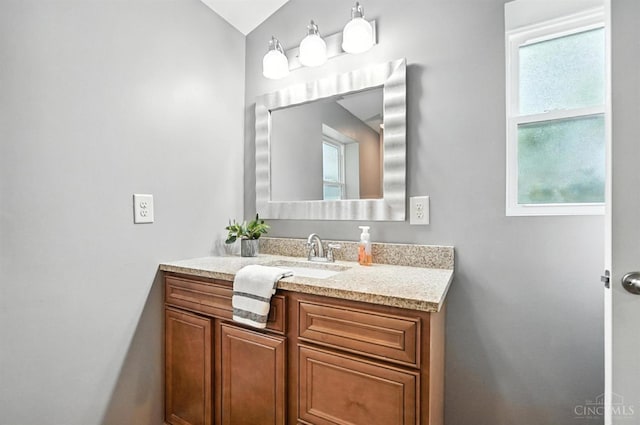 8135 Faller Rd, Hamilton Twp, OH 45039 - bathroom with vanity, healthy amount of natural light, and lofted ceiling