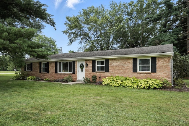 8135 Faller Rd, Hamilton Twp, OH 45039 - ranch-style house featuring a front lawn, brick siding, and roof with shingles