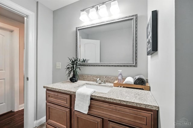 8135 Faller Rd, Hamilton Twp, OH 45039 - bathroom featuring vanity and wood finished floors