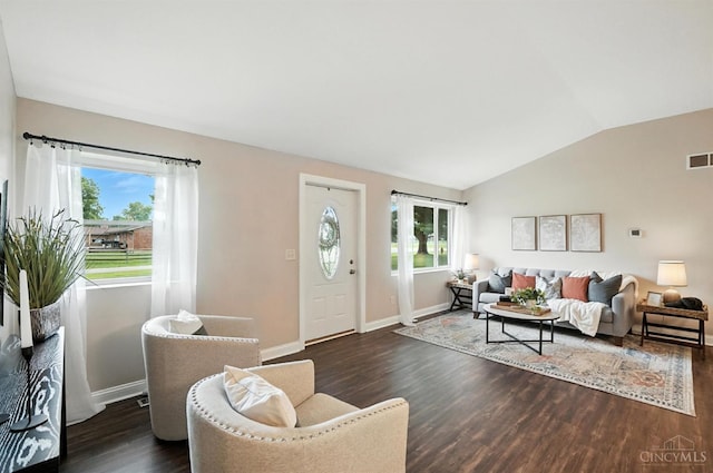8135 Faller Rd, Hamilton Twp, OH 45039 - living room with healthy amount of natural light, vaulted ceiling, and dark wood-style flooring