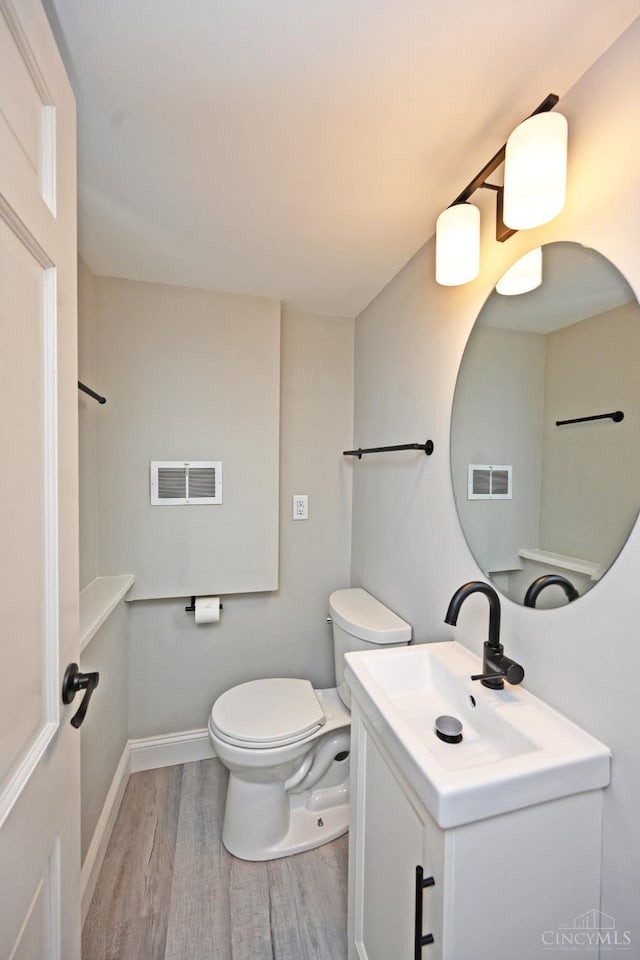 64 Craig Dr, Hamilton, OH 45013 - bathroom featuring wood finished floors and vanity