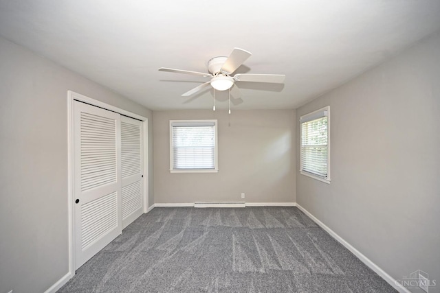 64 Craig Dr, Hamilton, OH 45013 - unfurnished bedroom featuring a closet, dark colored carpet, and ceiling fan