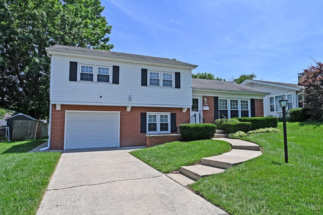 64 Craig Dr, Hamilton, OH 45013 - split level home featuring a garage, brick siding, and driveway