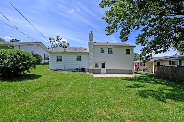 64 Craig Dr, Hamilton, OH 45013 - back of house with a chimney and a patio area