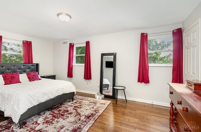 3340 Algus Ln, Green Twp, OH 45248 - bedroom with wood finished floors and multiple windows