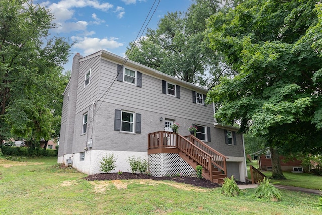 3340 Algus Ln, Green Twp, OH 45248 - back of property featuring a chimney, a yard, a garage, and stairway