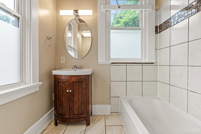 5824 Saranac Ave, Cincinnati, OH 45224 - full bath with a bathtub, vanity, and healthy amount of natural light