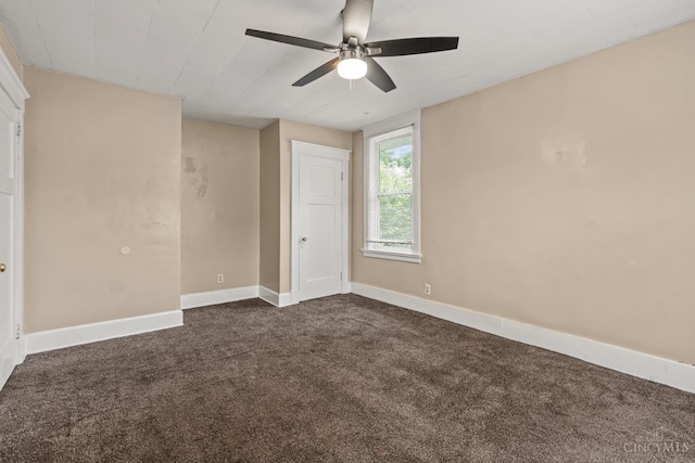 5824 Saranac Ave, Cincinnati, OH 45224 - unfurnished bedroom with dark carpet and a ceiling fan