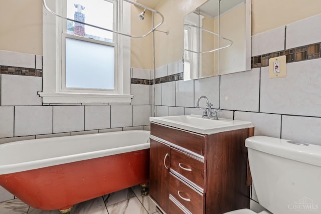 5824 Saranac Ave, Cincinnati, OH 45224 - bathroom featuring tile walls, vanity, marble look tiles, and  shower combination