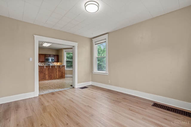 5824 Saranac Ave, Cincinnati, OH 45224 - spare room featuring light wood-type flooring and baseboards