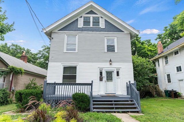 5824 Saranac Ave, Cincinnati, OH 45224 - back of property with a lawn and a deck