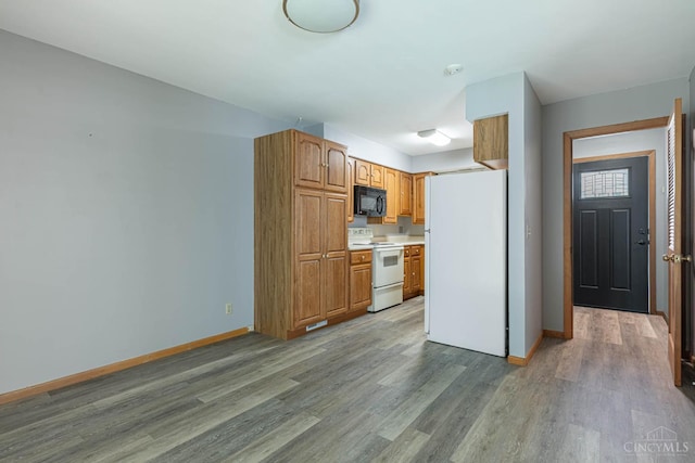 27 N Breiel, Middletown, OH 45042 - kitchen featuring white appliances, wood finished floors, light countertops, and brown cabinets