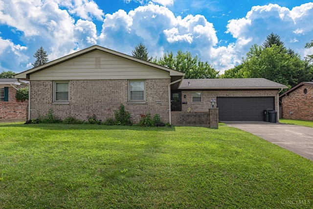 27 N Breiel, Middletown, OH 45042 - single story home featuring a garage, concrete driveway, a front lawn, and brick siding