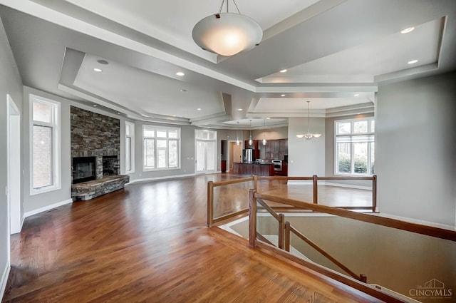 4994 Maxwell Dr, Mason, OH 45040 - living room with a raised ceiling, wood finished floors, healthy amount of natural light, and a fireplace
