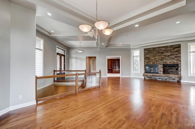 4994 Maxwell Dr, Mason, OH 45040 - unfurnished living room featuring wood finished floors, recessed lighting, beam ceiling, a chandelier, and a fireplace