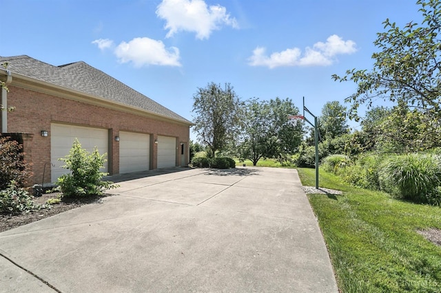 4994 Maxwell Dr, Mason, OH 45040 - view of home's exterior featuring concrete driveway, brick siding, a shingled roof, and an attached garage