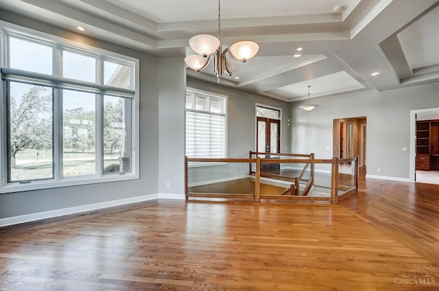 4994 Maxwell Dr, Mason, OH 45040 - spare room featuring healthy amount of natural light, wood finished floors, recessed lighting, a chandelier, and coffered ceiling