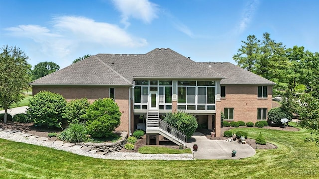 4994 Maxwell Dr, Mason, OH 45040 - rear view of house with a patio area, a sunroom, roof with shingles, a yard, and stairs