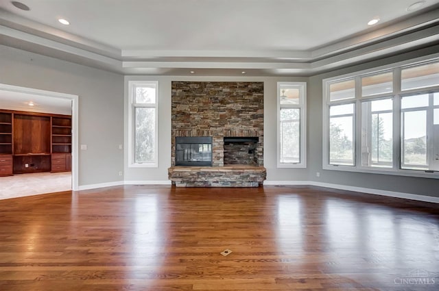 4994 Maxwell Dr, Mason, OH 45040 - unfurnished living room featuring a tray ceiling, wood finished floors, a fireplace, and recessed lighting