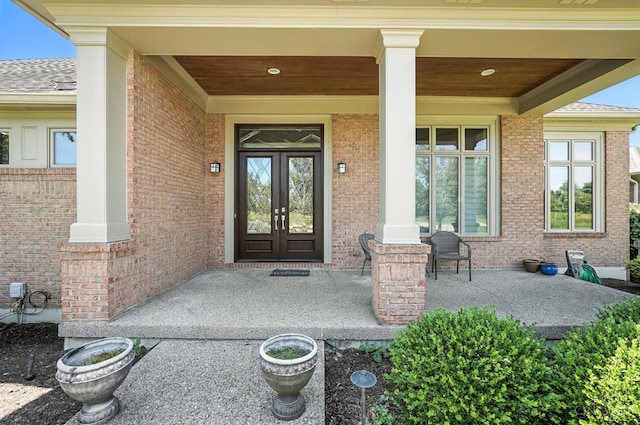 4994 Maxwell Dr, Mason, OH 45040 - doorway to property with a porch, brick siding, and roof with shingles