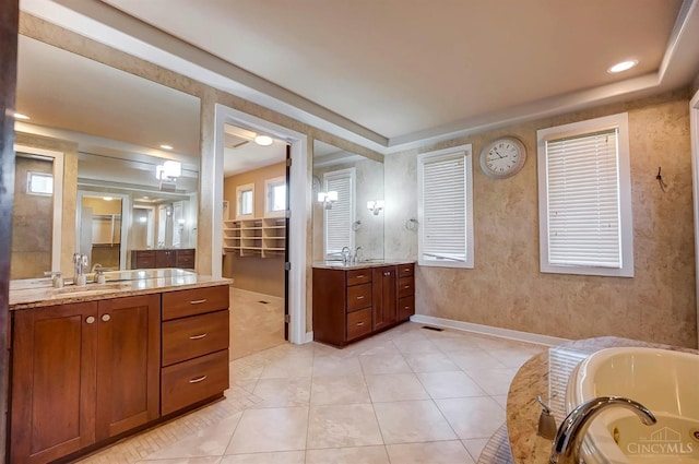 4994 Maxwell Dr, Mason, OH 45040 - bathroom with two vanities, a whirlpool tub, tile patterned floors, and recessed lighting