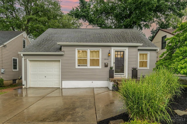 6846 Bryn Mawr Dr, Springfield Twp, OH 45224 - view of front of home featuring a shingled roof, concrete driveway, and a garage
