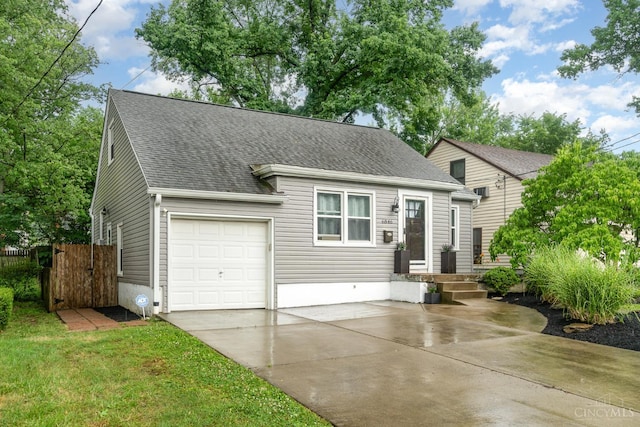 6846 Bryn Mawr Dr, Springfield Twp, OH 45224 - view of front of property featuring driveway, a shingled roof, a garage, and a gate