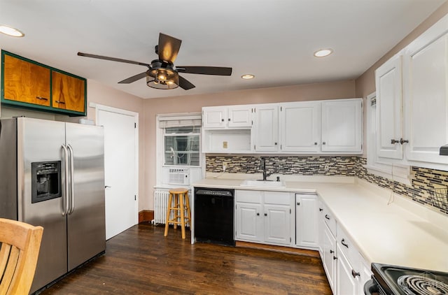 6846 Bryn Mawr Dr, Springfield Twp, OH 45224 - kitchen with stainless steel fridge, black dishwasher, ceiling fan, radiator, and decorative backsplash