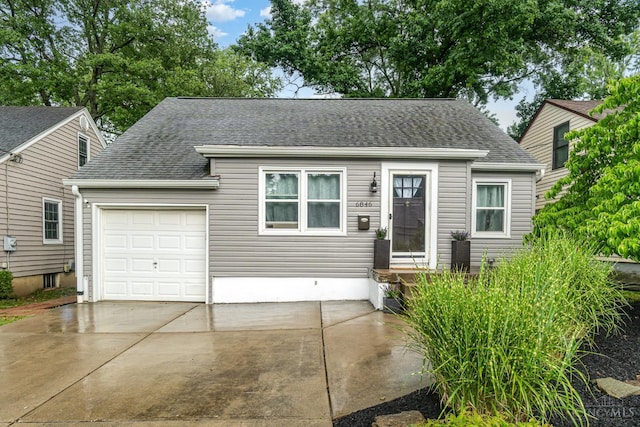 6846 Bryn Mawr Dr, Springfield Twp, OH 45224 - view of front of home featuring roof with shingles, driveway, and a garage