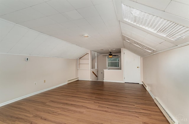 6846 Bryn Mawr Dr, Springfield Twp, OH 45224 - bonus room with a baseboard radiator, wood finished floors, vaulted ceiling, and baseboard heating