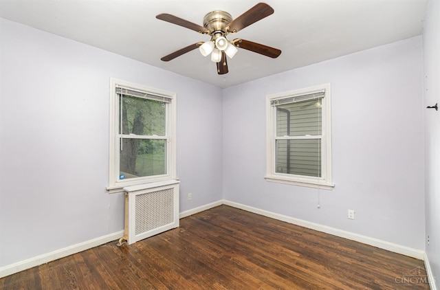6846 Bryn Mawr Dr, Springfield Twp, OH 45224 - spare room with radiator heating unit, wood finished floors, and ceiling fan