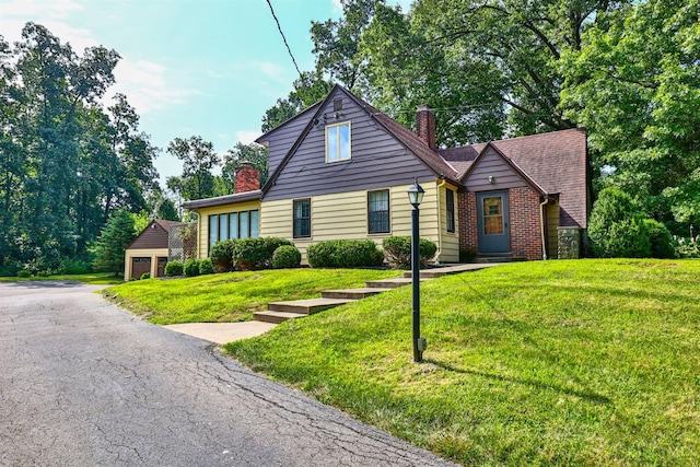 5868 Greenlawn Rd, Fairfield Twp, OH 45011 - view of front of house featuring a chimney, a front yard, and a garage