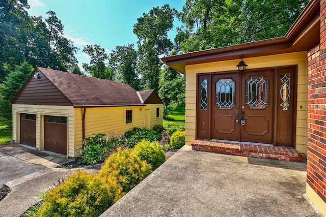 5868 Greenlawn Rd, Fairfield Twp, OH 45011 - entrance to property featuring brick siding and a detached garage