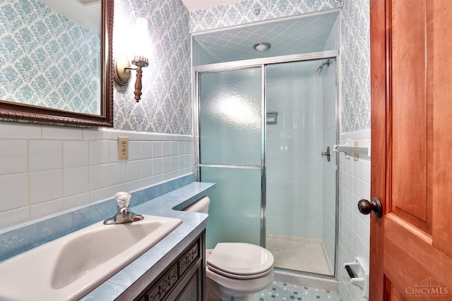 5868 Greenlawn Rd, Fairfield Twp, OH 45011 - full bathroom featuring wallpapered walls, a shower stall, vanity, tile walls, and wainscoting